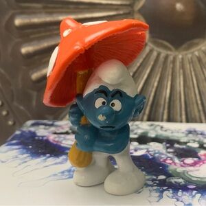 Vintage Blue and White Smurf Figurine with Orange Umbrella Peyo